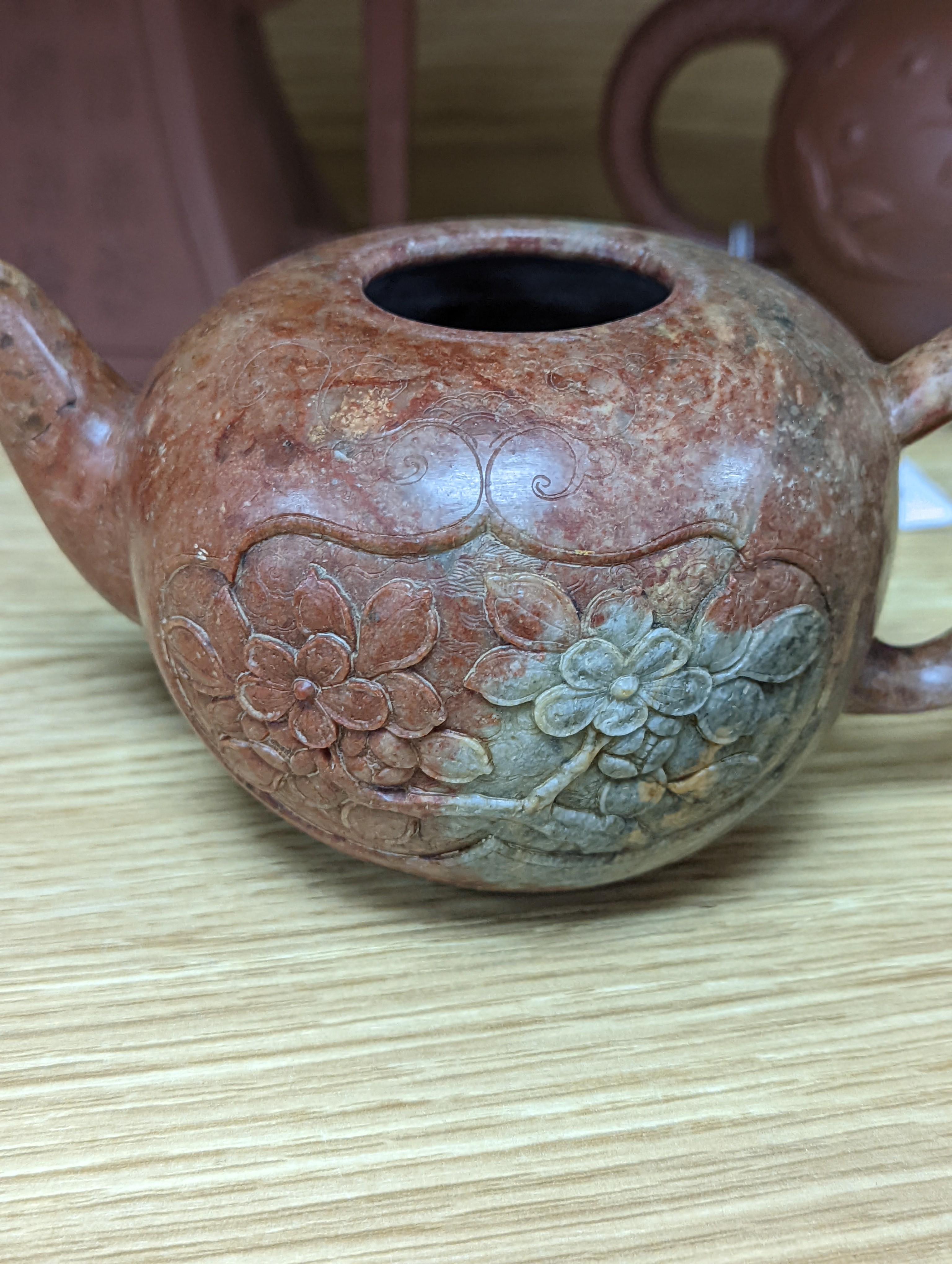 Three Chinese Yixing teapots and a carved soapstone teapot tallest 12cm